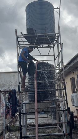 Water tank maintenance and hose storage activities in Ado
