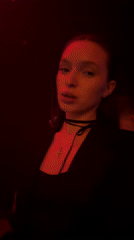 Woman speaks to camera in red lighting, Moscow