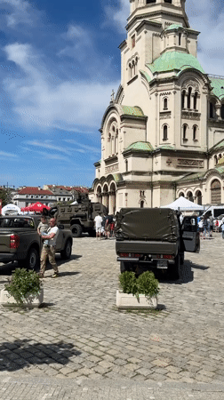 Military event with decorated vehicles at Sofia cathedral plaza