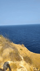 Rocky clifftop road meets Mediterranean blue, l'Alfàs del Pi