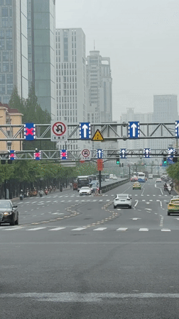 Late night traffic captured at busy Shanghai intersection