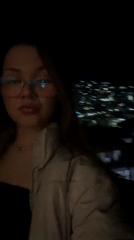 Woman smoking outdoors at night in Veliko Tarnovo