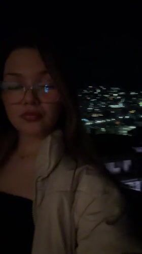 Woman smoking outdoors at night in Veliko Tarnovo