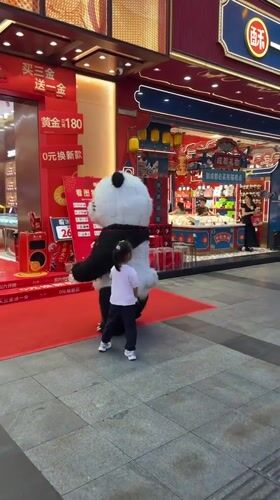 Child encounters panda performer on decorated street in Jinjiang