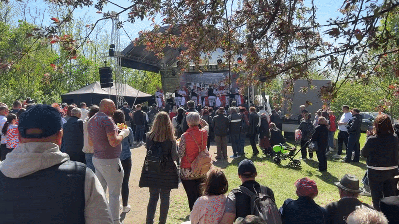 Traditional Romanian dancers perform for crowd in Gaura Sângerului