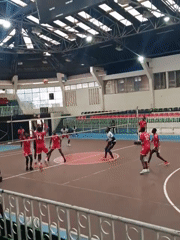 Indoor volleyball match between male teams in Nairobi arena