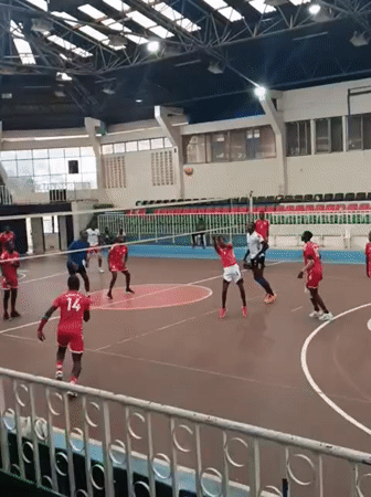Indoor volleyball match between male teams in Nairobi arena