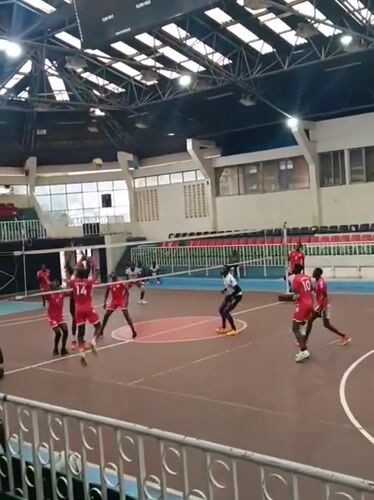 Indoor volleyball match between male teams in Nairobi arena