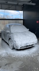 Silver VW Beetle gets washed at Dobrich car wash