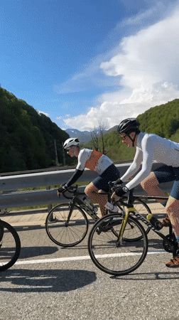 Cyclists ride past distracted driver taking selfie in Russia