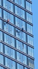 Window washers service high-rise building in Khimki, Russia
