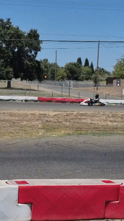 Go-kart #454 races on an outdoor track in Rancho Cordova