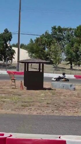Go-kart #454 races on an outdoor track in Rancho Cordova