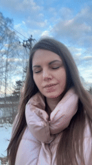 Woman records outdoor selfie video in rural Slobodka, Russia