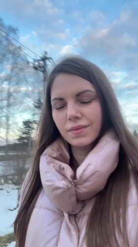 Woman records outdoor selfie video in rural Slobodka, Russia
