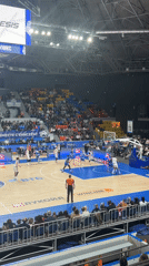 Basketball game underway in Krasnoyarsk arena with spectators present