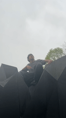 Young man explores Strasbourg climbing structures, visiting urban spots