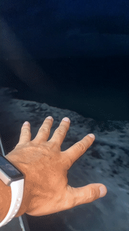 Smartwatch wearer captured on video near nighttime ocean waves