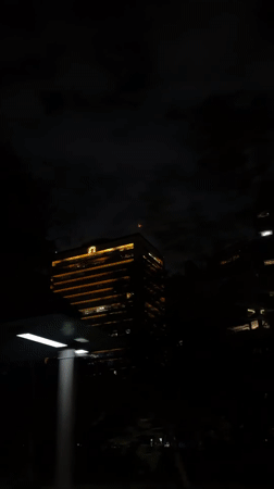 Nighttime building with Bitso ad captured in Mexico City
