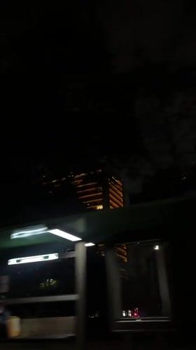 Nighttime building with Bitso ad captured in Mexico City