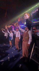 Retro-dressed group dances at Thailand club venue