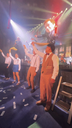 Retro-dressed group dances at Thailand club venue