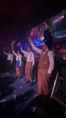 Retro-dressed group dances at Thailand club venue