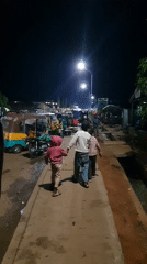 Nighttime street scenes document traffic, commerce in Bukuru Nigeria