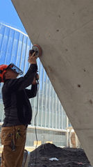 Construction worker repairs concrete structures in Ramat HaSharon