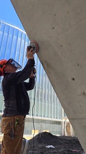 Construction worker repairs concrete structures in Ramat HaSharon