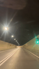 Road tunnel near Sotonići, Montenegro, with red entry signal