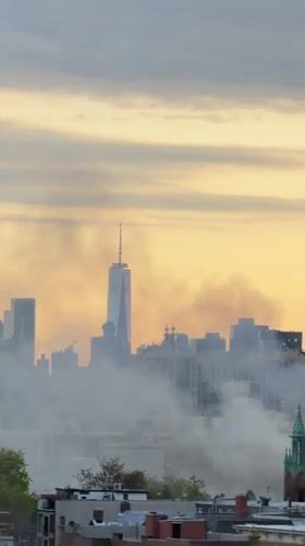NYC skyline filmed from elevated viewpoint featuring One World Trade
