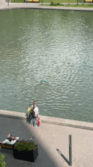 Woman visits urban pond in Moscow residential area