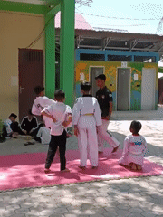 Outdoor Taekwondo class conducted for children in Lhokseumawe, Indonesia