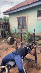 Men exercise with homemade gym equipment in Akwanga yards