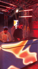 Evening party with DJ and red lighting in Oslo
