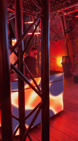Evening party with DJ and red lighting in Oslo