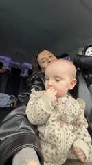 Mother and baby share quiet moment in parked Moscow car