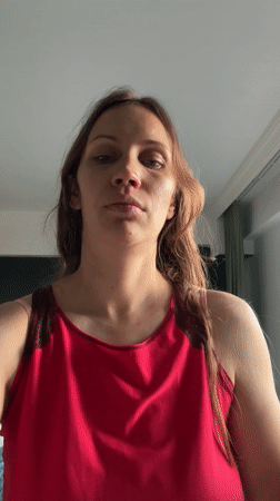 Woman performs skincare routine indoors in Fethiye