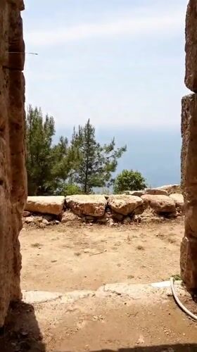 Tourist explores ancient castle ruins in Alanya, Turkey