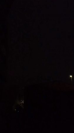 Lightning and street lights pierce a stormy night in Viadana