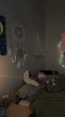 Candlelit bedroom scene captured in Liepāja evening