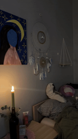 Candlelit bedroom scene captured in Liepāja evening