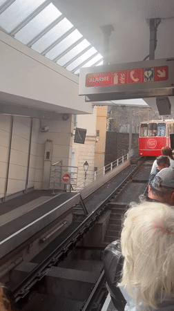 Funicular arrives at Lyon Fourviere station with boarding passengers