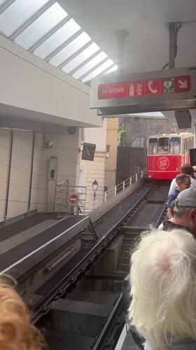 Funicular arrives at Lyon Fourviere station with boarding passengers