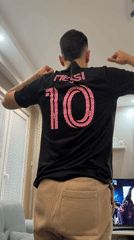 Couple poses playfully in Messi jerseys at Plovdiv home