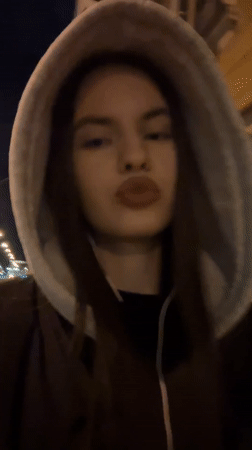 Evening pedestrians navigate Saint Petersburg streets Thursday night