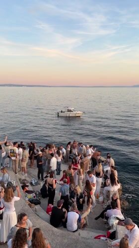 Evening gathering draws dozens to Rijeka waterfront at sunset