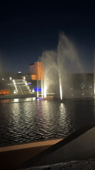 Illuminated fountain display captured on Cheboksary lake at night