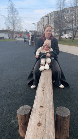 Mother and baby enjoy playground time in Pokrov, Russia